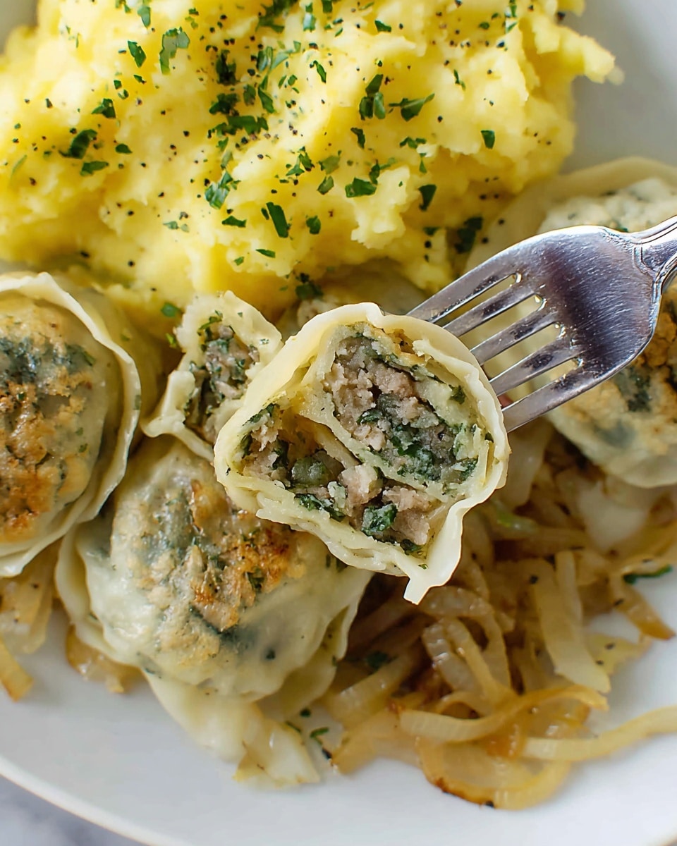 The image shows a close-up of a white plate filled with three layers. The bottom layer has caramelized translucent onions, long and thin with a slight golden brown tint. The middle layer features several folded, light beige dumplings or pasta pockets with slightly browned spots on the surface, each cut to show a green and gray mixed filling inside made of finely chopped vegetables and meat. The top layer is composed of yellow, chunky mashed potatoes sprinkled with bits of green herbs and black pepper. A silver fork with four prongs holds a dumpling piece above the onions, showing its textured filling clearly. The scene is set on a white marbled surface. photo taken with an iphone --ar 4:5 --v 7