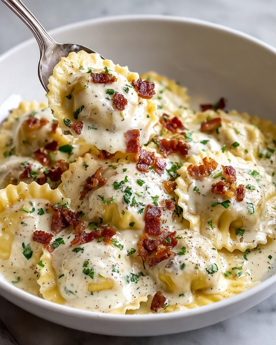A white bowl filled with several round ravioli pieces covered in a creamy white sauce, topped with small crispy brown bacon bits and green chopped herbs, with some grated cheese sprinkled evenly over the pasta. A silver spoon held by a woman's hand lifts a ravioli piece, showing the smooth sauce texture and vibrant garnishes. The dish sits on a white marbled surface, with soft natural lighting enhancing the rich colors and creamy texture. photo taken with an iphone --ar 4:5 --v 7