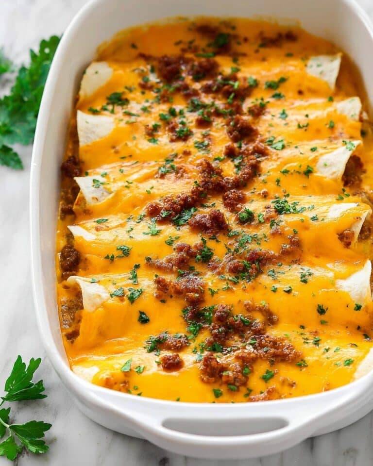 Breakfast Enchiladas with Sausage, Bacon, and Cheddar Recipe